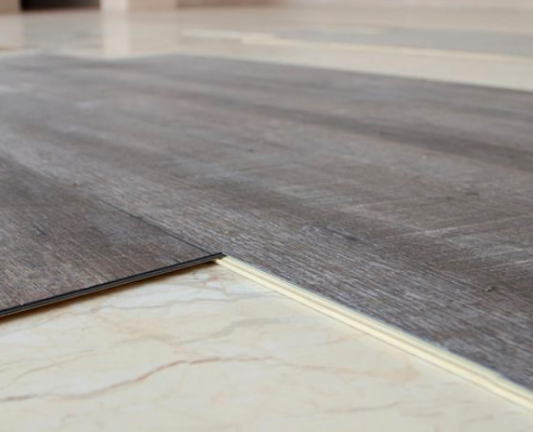 Install SPC flooring on tiles